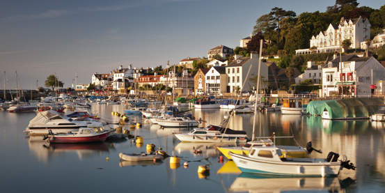 numerous boats moored up to buoys